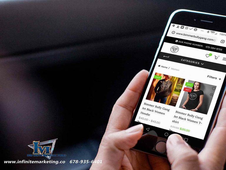 Hand holding a smartphone showing the Bimmer Bully Gang online store